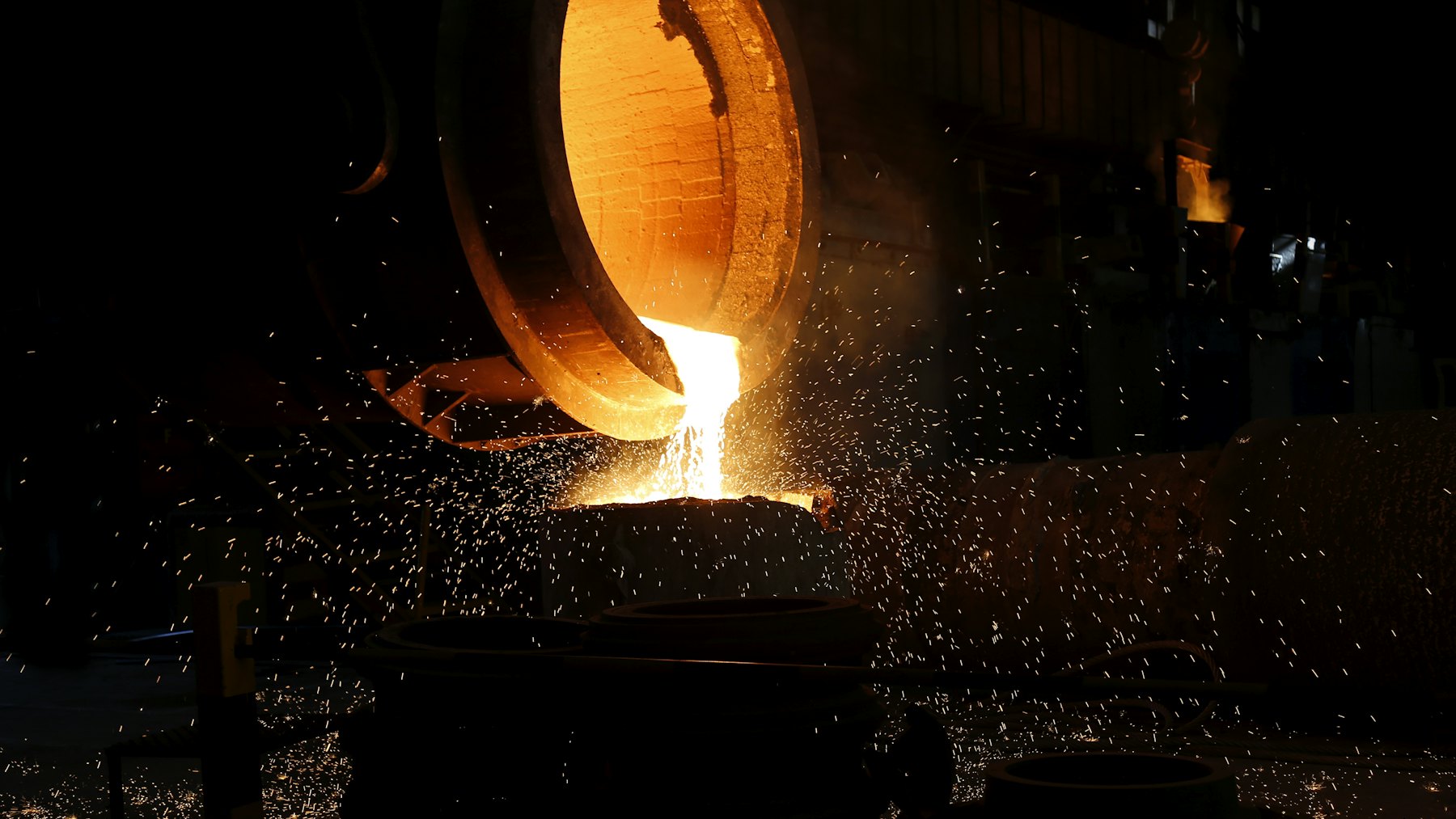 Molten metal pouring in a stream of sparks