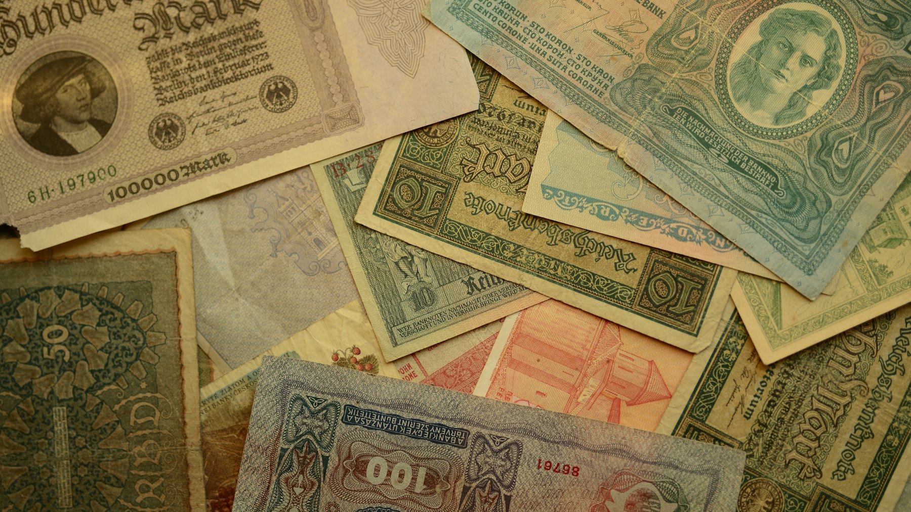 Obsolete banknotes from several countries, overlapping